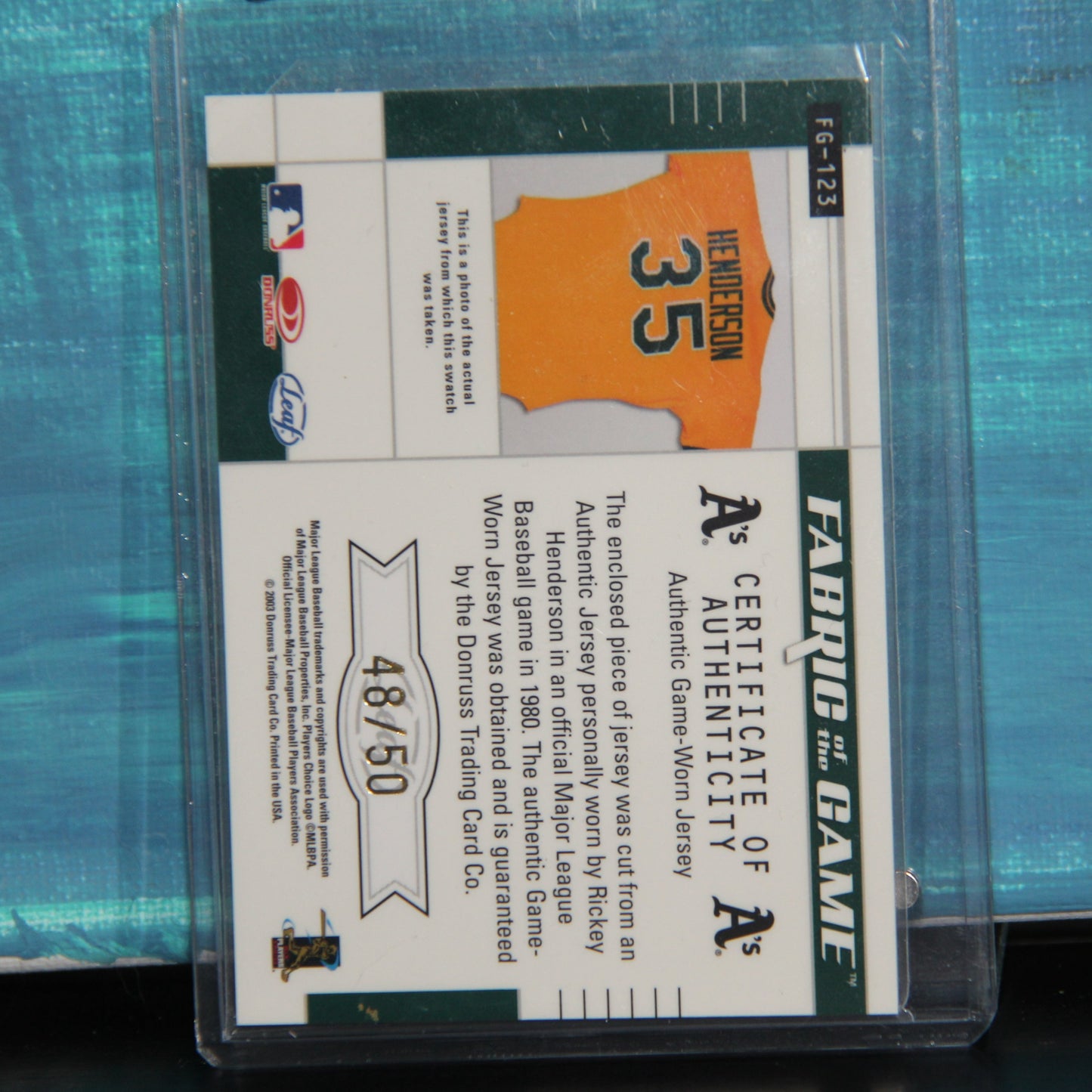 2003 Leaf Certified #FG-123 Rickey Henderson Fabric of the Game Oakland 48/50